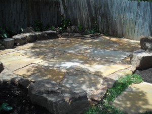 Nice backyard patio with stone seating set in decomposed granite austin tx